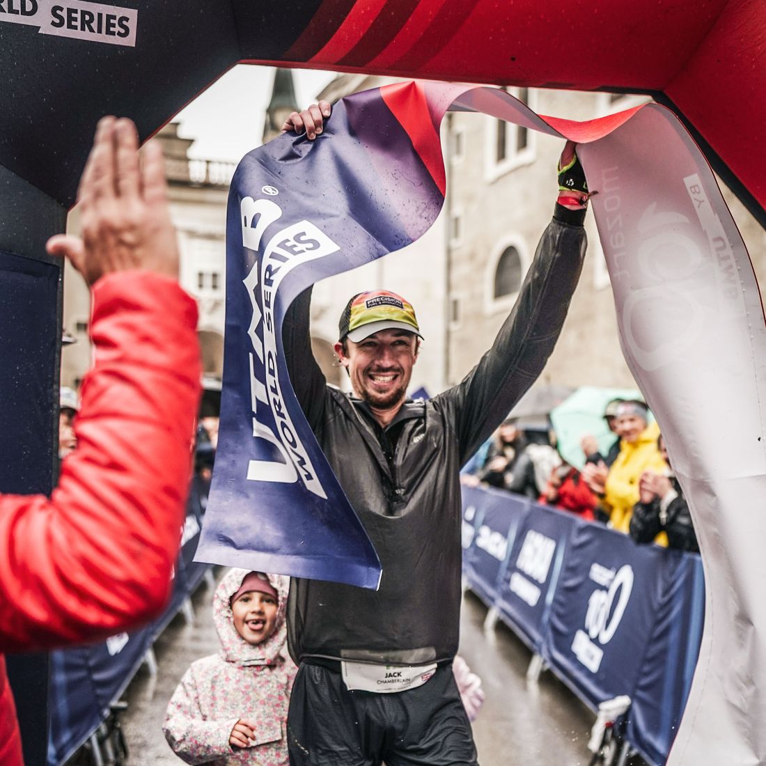 Jack Chamberlain lifting the finish tape after winning the Mozart 100 in 2024.